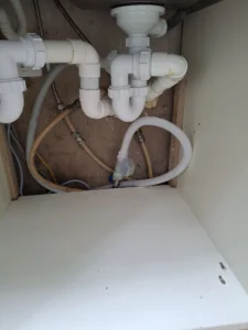 Under-sink drainage system checked by Emergency Plumber Dublin during kitchen repair